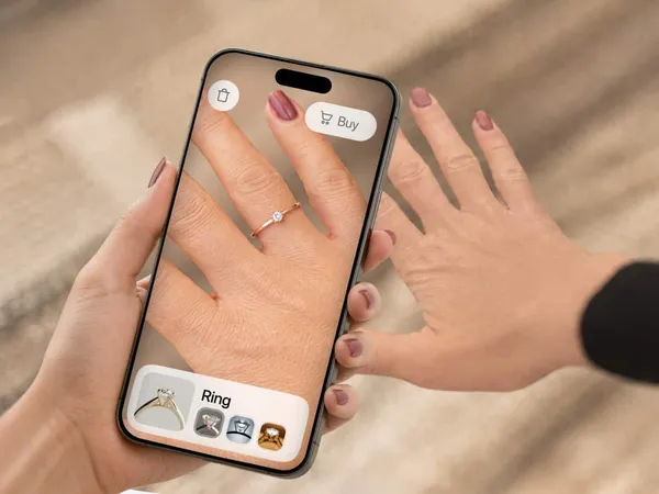 A phone showing a ring tried on the shopper’s own hand