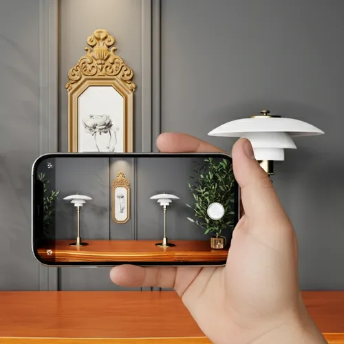 A hand holding a phone that shows two table lamps placed on a real sideboard