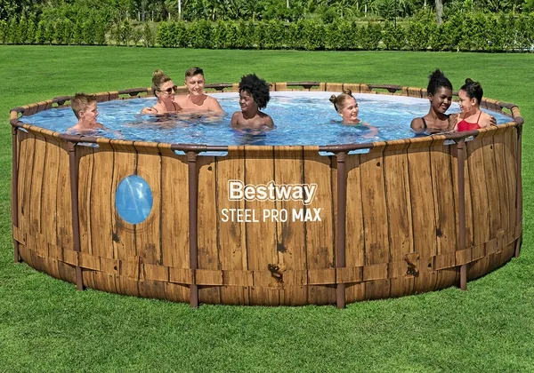 People relaxing in a large above-ground frame pool on a lawn