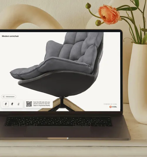 The Vizbl 3D viewer running on a laptop next to a vase of flowers