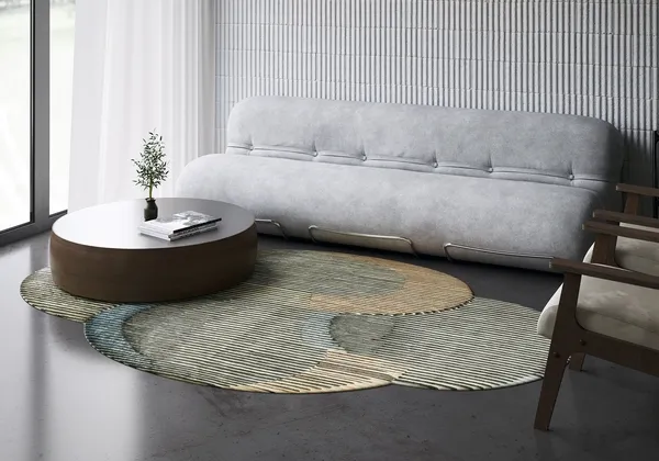 A patterned round rug under a coffee table and sofa
