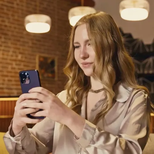A shopper viewing a product in augmented reality on her phone